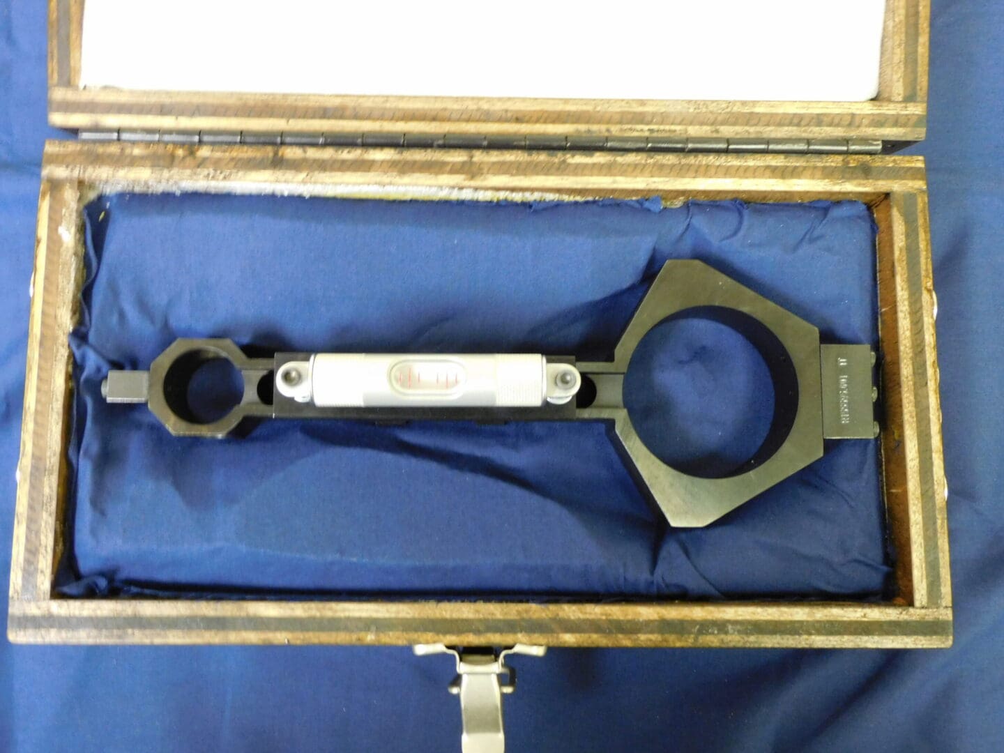 A wrench in the middle of a box.